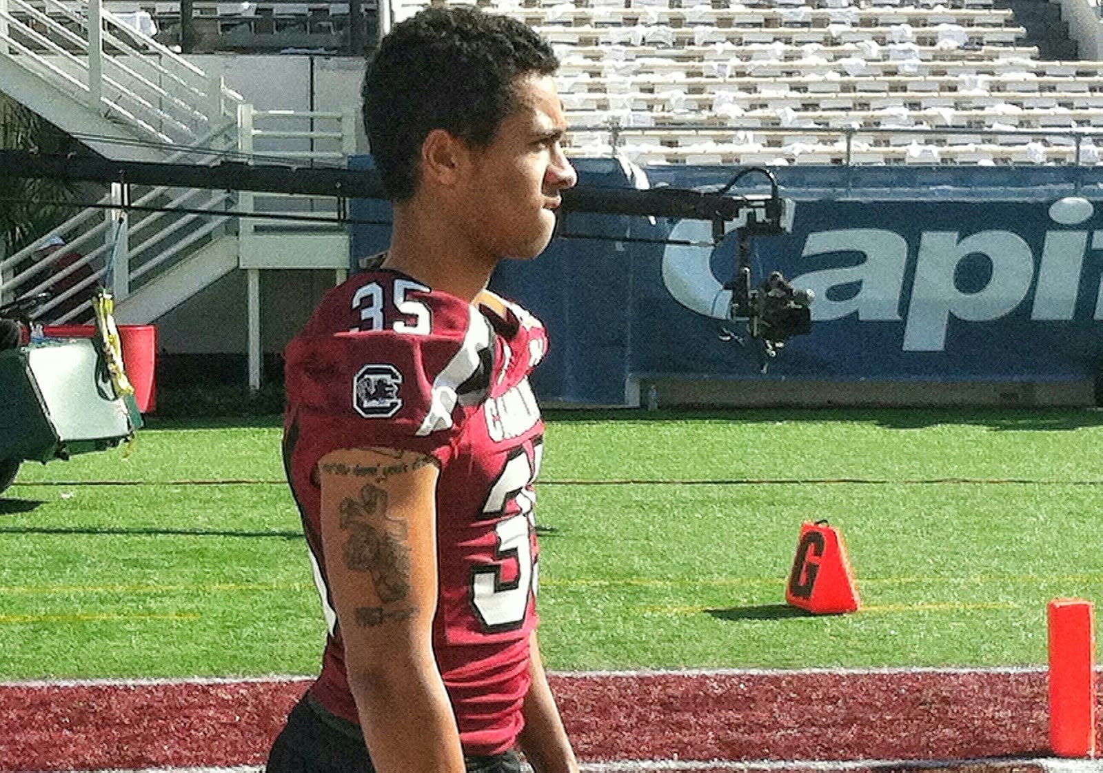 Ben Harvey in a Carolina number 35 game jersey on the sideline