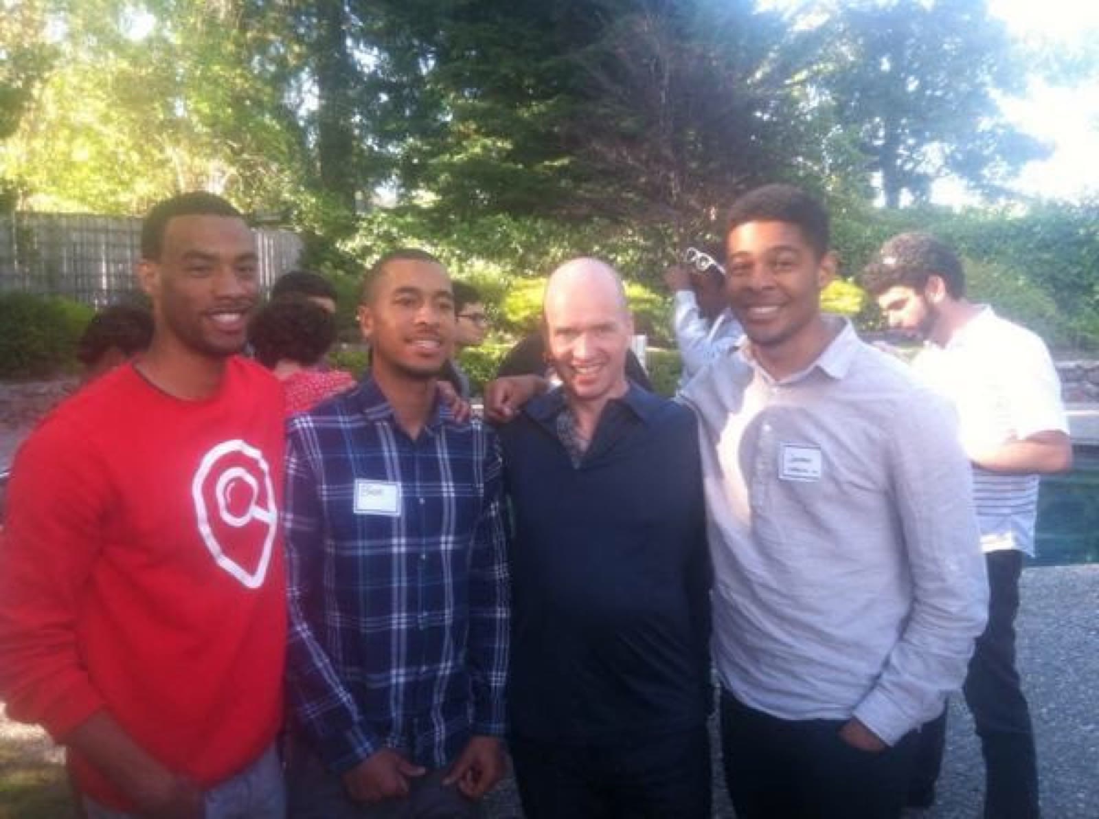 Ben Harvey standing with investor Ben Horowitz and others