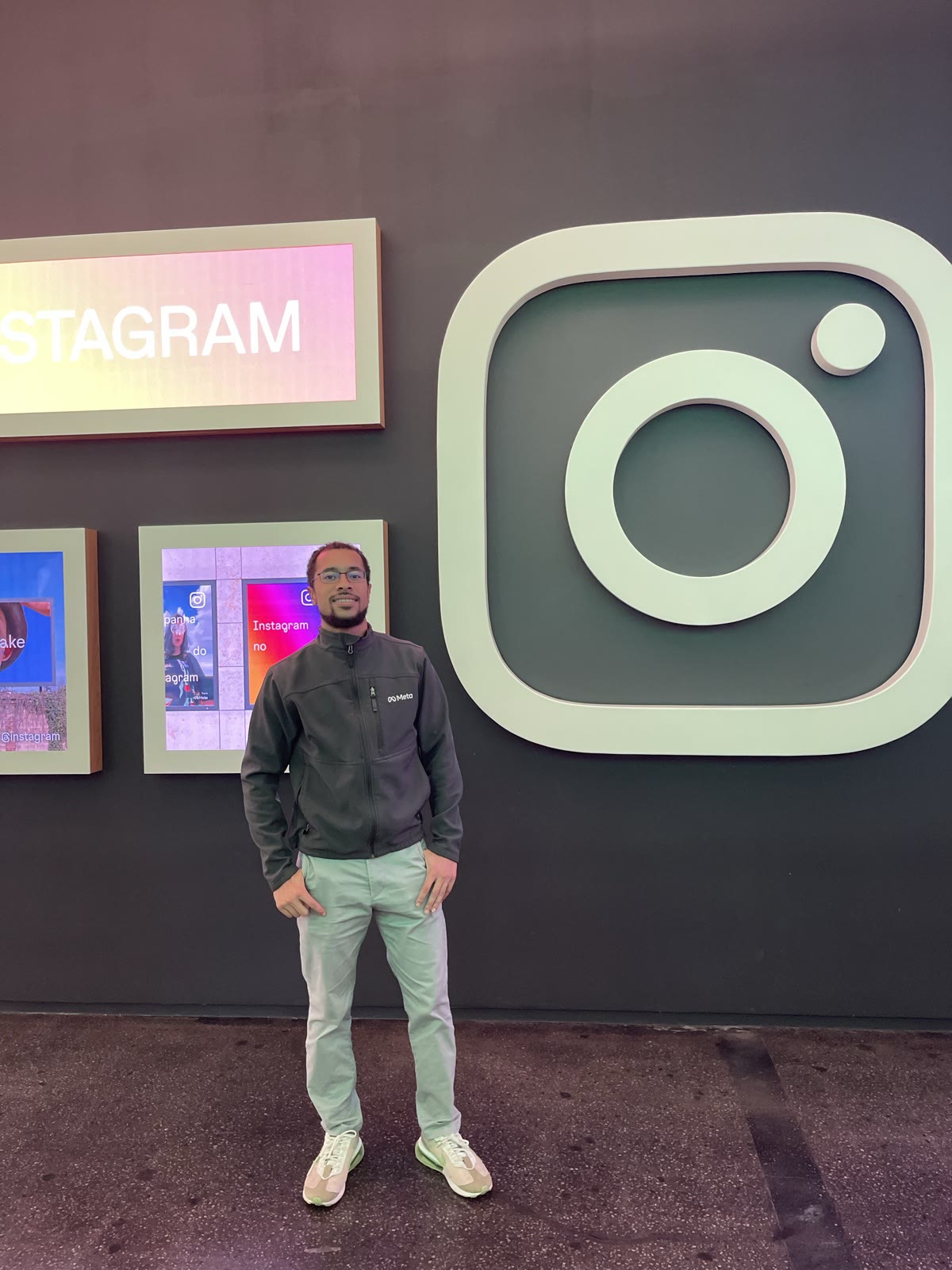 Ben Harvey in front of the large Instagram logo at Meta