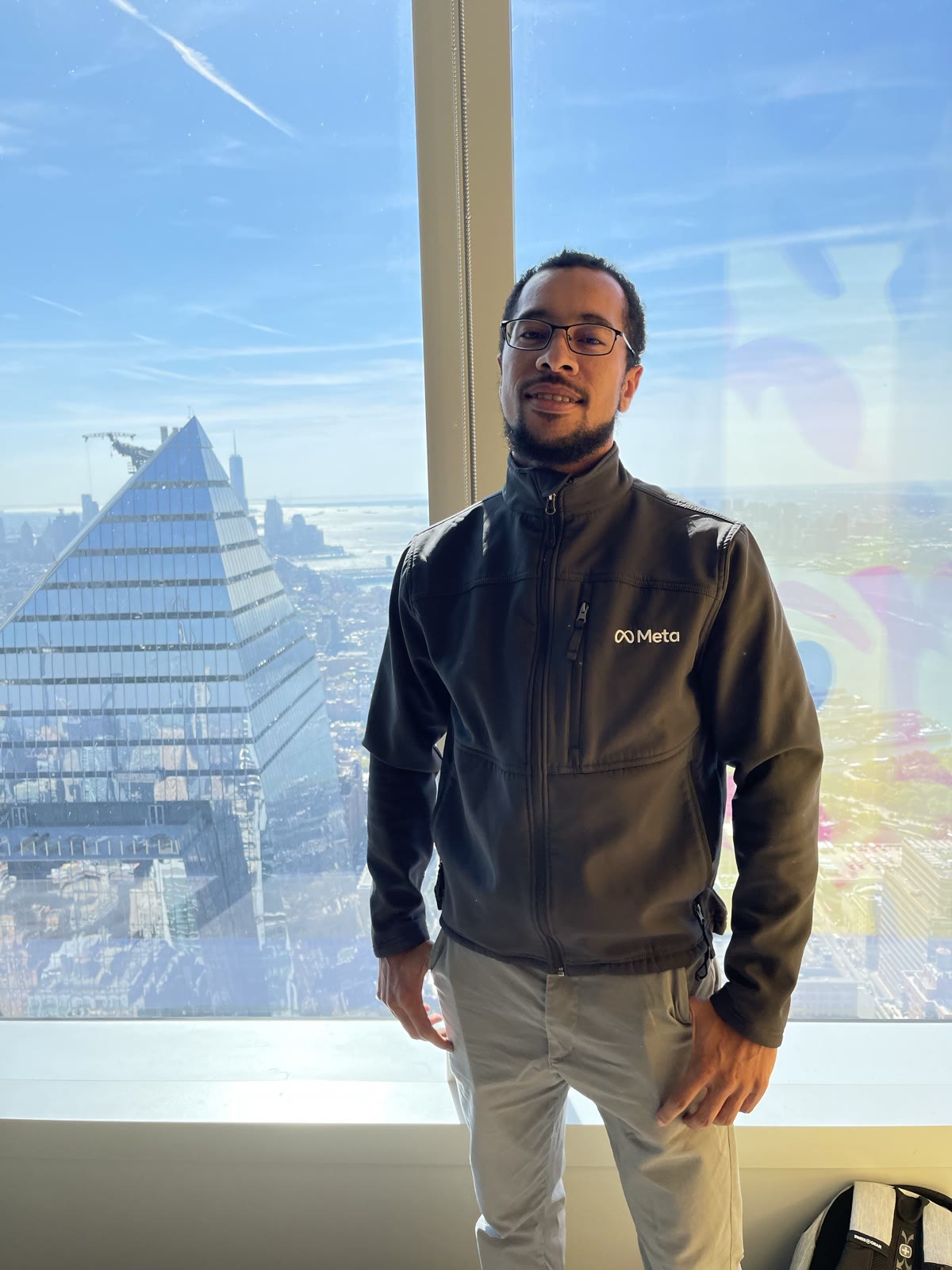 Ben Harvey in a Meta jacket on the top floor of Meta's New York office